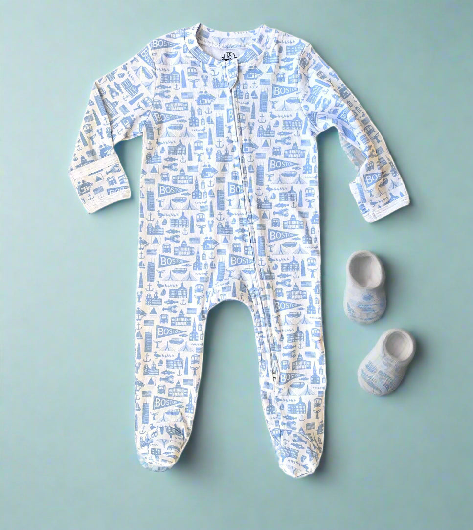 White zippered baby onesie with blue Boston Massachusetts landmark pattern